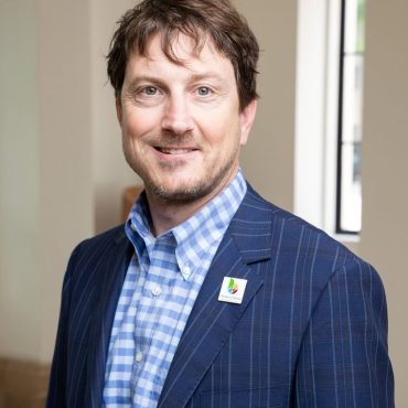 Photo of man smiling at camera