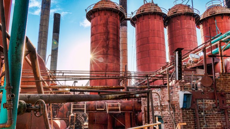 Photo of an industrial part of Sloss Furances showing silos and pipes