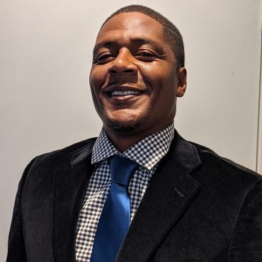 Photo of man smiling at camera