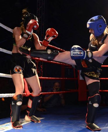 Photo of women kickboxing