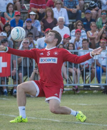 Photo of man playing fistball