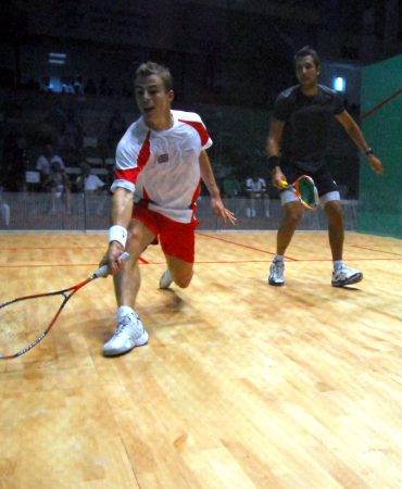 Photo of two men playing squash