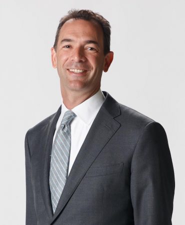 Photo of man smiling at camera